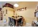Dining area with a dark table and chairs with decor on walls and soffit at 9504 Laurel Ledge Dr, Riverview, FL 33569