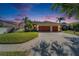 Charming home featuring a well-manicured lawn, mature landscaping, and a two-car garage, perfect for curb appeal at 9504 Laurel Ledge Dr, Riverview, FL 33569