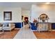 Hallway with decorative furniture, elegant wall decor and view of the living area creates a sense of warmth and sophistication at 9504 Laurel Ledge Dr, Riverview, FL 33569