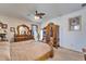 Main bedroom featuring carpet floors, a decorative ceiling fan, and natural light at 9504 Laurel Ledge Dr, Riverview, FL 33569