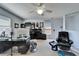 Home office with a large computer desk and built-in shelves at 9504 Laurel Ledge Dr, Riverview, FL 33569