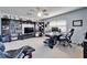 Large home office featuring built-in bookcases and a computer desk at 9504 Laurel Ledge Dr, Riverview, FL 33569