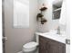 Modern bathroom featuring wood shelves for decor and an updated vanity at 102 Crestwood Ln, Largo, FL 33770