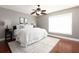 Serene bedroom with a large window, soft rug, and modern decor at 102 Crestwood Ln, Largo, FL 33770
