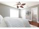 Bright bedroom features a ceiling fan and leads to an ensuite bathroom at 102 Crestwood Ln, Largo, FL 33770