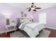 Cozy bedroom with plush gray accents and a modern ceiling fan at 102 Crestwood Ln, Largo, FL 33770