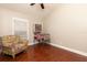 Inviting bedroom space with a retro pinball machine and natural light at 102 Crestwood Ln, Largo, FL 33770
