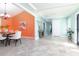 Light, bright dining room with tile flooring and walls of coral and mint green tones at 102 Crestwood Ln, Largo, FL 33770