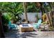 Cozy outdoor fire pit area with colorful Adirondack chairs, perfect for relaxing evenings at 102 Crestwood Ln, Largo, FL 33770