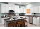 Well-appointed kitchen featuring modern appliances, ample counter space, and pendant lighting at 102 Crestwood Ln, Largo, FL 33770