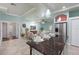 Open-concept living area with stylish furnishings, modern decor, and a kitchen island featuring a granite countertop at 102 Crestwood Ln, Largo, FL 33770