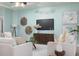 Airy living room featuring comfortable seating, modern decor, and plenty of natural light at 102 Crestwood Ln, Largo, FL 33770
