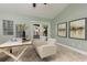 Bright and airy office space with neutral tiling and stylish decor with a clear view into the pool area at 102 Crestwood Ln, Largo, FL 33770