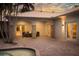 Comfortable outdoor seating on a brick patio with stone columns and access to the house at 102 Crestwood Ln, Largo, FL 33770