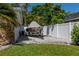 Gravel area beside home has a boat trailer for storing a boat or other outdoor toys at 102 Crestwood Ln, Largo, FL 33770