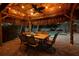 Charming tiki hut featuring an overhead fan, festive string lights, and comfortable seating at 102 Crestwood Ln, Largo, FL 33770