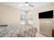 Cozy bedroom with large window for natural light and a TV at 10423 Sand Lark Ave, Weeki Wachee, FL 34614