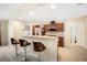 Well-lit kitchen showcasing granite counters, barstool seating, and modern appliances at 10423 Sand Lark Ave, Weeki Wachee, FL 34614