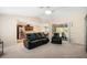 Spacious living area featuring an open concept design with views of the kitchen and outdoor patio at 10423 Sand Lark Ave, Weeki Wachee, FL 34614