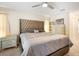 Well-lit main bedroom featuring a large window and light dresser at 10423 Sand Lark Ave, Weeki Wachee, FL 34614
