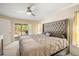 Spacious main bedroom with sliding glass door to screened patio at 10423 Sand Lark Ave, Weeki Wachee, FL 34614