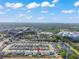 Lovely aerial view of community, highlighting nearby pond and neighborhood layout at 10814 Whitland Grove Dr, Riverview, FL 33578