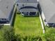 Aerial view of a home with a large, fenced-in backyard and covered patio, nestled between other homes at 10814 Whitland Grove Dr, Riverview, FL 33578