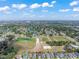 Beautiful aerial view of the neighborhood, showing proximity to community sports complex and lake at 10814 Whitland Grove Dr, Riverview, FL 33578