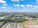 An aerial view shows the home's location within a well-developed community, near lakes and recreation at 10814 Whitland Grove Dr, Riverview, FL 33578