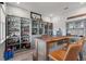 Home bar featuring ample shelving and a custom wood countertop, perfect for entertaining friends and Gathering at 10814 Whitland Grove Dr, Riverview, FL 33578