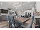 Open-concept dining room flows into the kitchen and living area, with seating for six at 10814 Whitland Grove Dr, Riverview, FL 33578