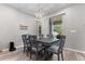 Charming dining room featuring a stylish light fixture and a sliding glass door to the patio at 10814 Whitland Grove Dr, Riverview, FL 33578
