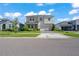 This property features a well-maintained yard, driveway, and complemented by tasteful landscaping at 10814 Whitland Grove Dr, Riverview, FL 33578