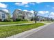 The house's exterior is beautifully accented by manicured lawn and complementing shrubbery at 10814 Whitland Grove Dr, Riverview, FL 33578