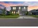 Charming two-story home with a well-maintained front lawn and inviting curb appeal at 10814 Whitland Grove Dr, Riverview, FL 33578