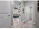 Hallway view showing the open layout with a seamless transition to the living room at 10814 Whitland Grove Dr, Riverview, FL 33578