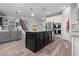 Spacious open kitchen featuring island with seating, stainless appliances, and living space access at 10814 Whitland Grove Dr, Riverview, FL 33578