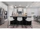 Contemporary kitchen featuring stainless steel appliances, an island with seating, and stylish backsplash at 10814 Whitland Grove Dr, Riverview, FL 33578