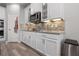 Kitchen featuring stainless steel appliances, clean white cabinetry, and a tiled backsplash at 10814 Whitland Grove Dr, Riverview, FL 33578