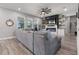 Relaxing living room with generous seating options and natural light, perfect for entertaining guests at 10814 Whitland Grove Dr, Riverview, FL 33578