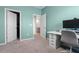 Home office space featuring a desk, chair, and open doorway at 10814 Whitland Grove Dr, Riverview, FL 33578
