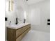 Modern bathroom with double vanity, round mirror, and elegant fixtures at 11611 Meridian Point Dr, Tampa, FL 33626
