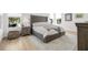 Bedroom features a large window, tufted headboard, and neutral decor at 11611 Meridian Point Dr, Tampa, FL 33626