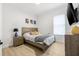 Inviting bedroom with a cozy bed, neutral decor, and a side table with a stylish lamp at 11611 Meridian Point Dr, Tampa, FL 33626