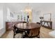 Bright dining room featuring a round table with seating for four under a modern chandelier at 11611 Meridian Point Dr, Tampa, FL 33626