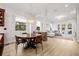 Open floor plan with dining area flowing into the living room with lots of light at 11611 Meridian Point Dr, Tampa, FL 33626