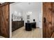 Bright office featuring modern desk, elegant sideboard and wood floors at 11611 Meridian Point Dr, Tampa, FL 33626