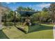 Community playground shaded by a canopy with swings, slides and jungle gym for fun outdoor play at 11611 Meridian Point Dr, Tampa, FL 33626