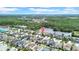 Stunning aerial view of a residential neighborhood with a large lake and lush greenery at 11712 Winterset Cove Dr, Riverview, FL 33579