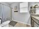 This bathroom features a tub-shower combo, neutral walls, and tiled floors at 11712 Winterset Cove Dr, Riverview, FL 33579